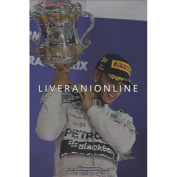 Race winner Lewis Hamilton (GBR) Mercedes AMG F1 celebrates on the podium. 19.04.2015. Formula 1 World Championship, Rd 4, Bahrain Grand Prix, Sakhir, Bahrain, Race Day. /Agenzia Aldo Liverani sas - ITALY ONLY - EDITORIAL USE ONLY - GARA