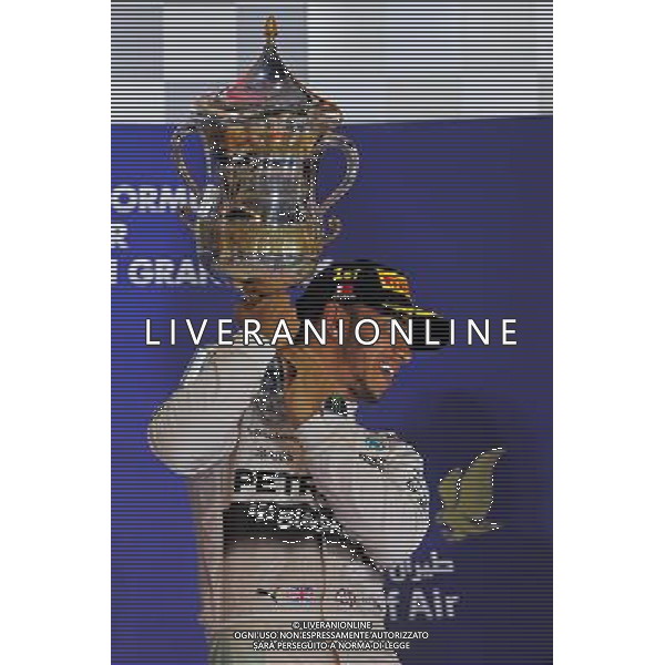 Race winner Lewis Hamilton (GBR) Mercedes AMG F1 celebrates on the podium. 19.04.2015. Formula 1 World Championship, Rd 4, Bahrain Grand Prix, Sakhir, Bahrain, Race Day. /Agenzia Aldo Liverani sas - ITALY ONLY - EDITORIAL USE ONLY - GARA