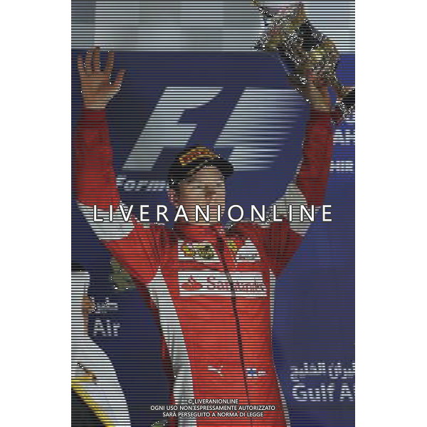 Kimi Raikkonen (FIN) Ferrari celebrates his second position on the podium. 19.04.2015. Formula 1 World Championship, Rd 4, Bahrain Grand Prix, Sakhir, Bahrain, Race Day. /Agenzia Aldo Liverani sas - ITALY ONLY - EDITORIAL USE ONLY - GARA