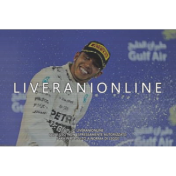 Race winner Lewis Hamilton (GBR) Mercedes AMG F1 celebrates on the podium. 19.04.2015. Formula 1 World Championship, Rd 4, Bahrain Grand Prix, Sakhir, Bahrain, Race Day. /Agenzia Aldo Liverani sas - ITALY ONLY - EDITORIAL USE ONLY - GARA