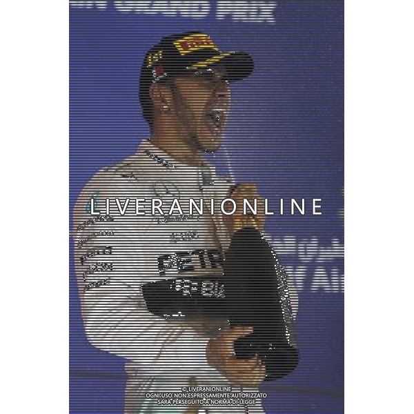 Race winner Lewis Hamilton (GBR) Mercedes AMG F1 celebrates on the podium. 19.04.2015. Formula 1 World Championship, Rd 4, Bahrain Grand Prix, Sakhir, Bahrain, Race Day. /Agenzia Aldo Liverani sas - ITALY ONLY - EDITORIAL USE ONLY - GARA