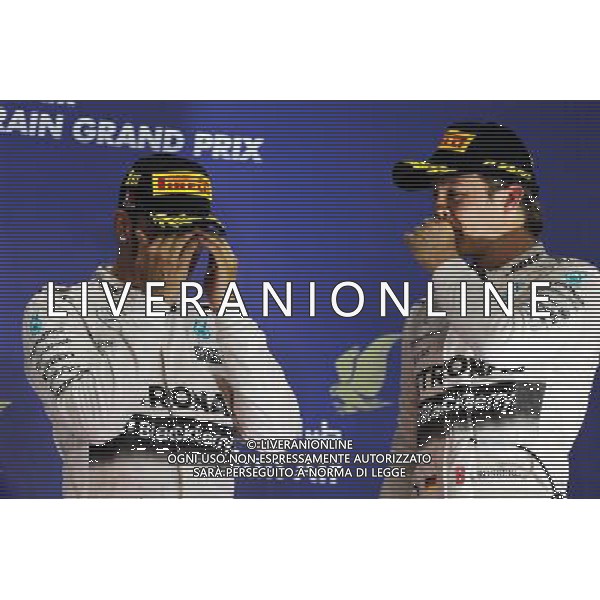 The podium (L to R): Race winner Lewis Hamilton (GBR) Mercedes AMG F1 with third placed team mate Nico Rosberg (GER) Mercedes AMG F1. 19.04.2015. Formula 1 World Championship, Rd 4, Bahrain Grand Prix, Sakhir, Bahrain, Race Day. /Agenzia Aldo Liverani sas - ITALY ONLY - EDITORIAL USE ONLY - GARA