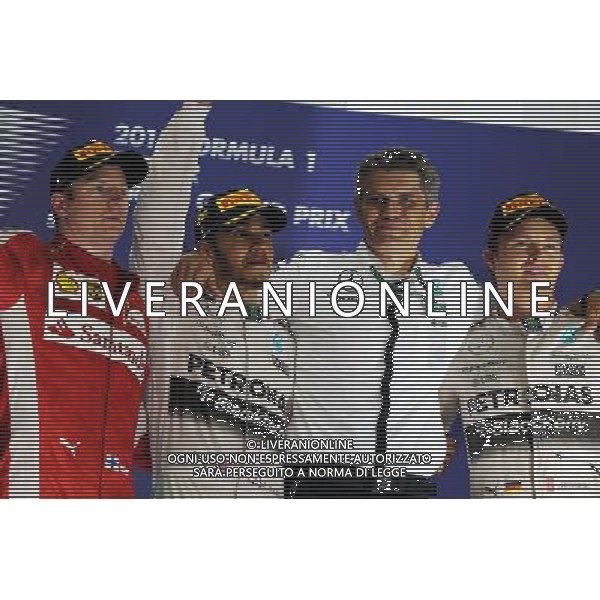 The podium (L to R): Kimi Raikkonen (FIN) Ferrari, second; Lewis Hamilton (GBR) Mercedes AMG F1, race winner; Nico Rosberg (GER) Mercedes AMG F1, third. 19.04.2015. Formula 1 World Championship, Rd 4, Bahrain Grand Prix, Sakhir, Bahrain, Race Day. /Agenzia Aldo Liverani sas - ITALY ONLY - EDITORIAL USE ONLY - GARA