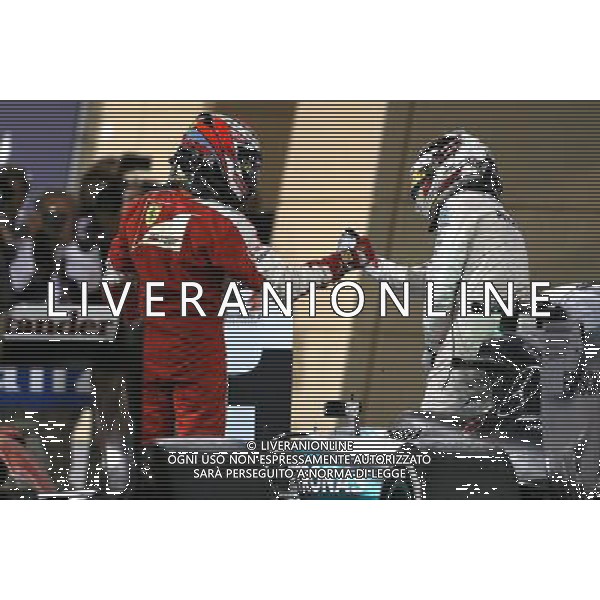 Kimi Raikkonen (FIN), Scuderia Ferrari and Lewis Hamilton (GBR), Mercedes AMG F1 Team 19.04.2015. Formula 1 World Championship, Rd 4, Bahrain Grand Prix, Sakhir, Bahrain, Race Day. /Agenzia Aldo Liverani sas - ITALY ONLY - EDITORIAL USE ONLY - GARA