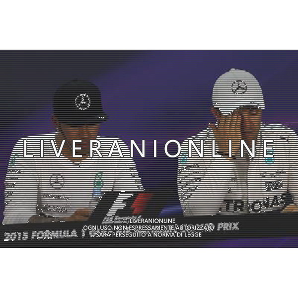 (L to R): Lewis Hamilton (GBR) Mercedes AMG F1 and team mate Nico Rosberg (GER) Mercedes AMG F1 in the FIA Press Conference. 18.04.2015. Formula 1 World Championship, Rd 4, Bahrain Grand Prix, Sakhir, Bahrain, Qualifying Day. AG ALDO LIVERANI SAS ONLY ITALY