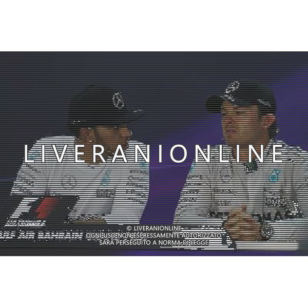 (L to R): Lewis Hamilton (GBR) Mercedes AMG F1 with team mate Nico Rosberg (GER) Mercedes AMG F1 in the FIA Press Conference. 19.04.2015. Formula 1 World Championship, Rd 4, Bahrain Grand Prix, Sakhir, Bahrain, Race Day. AG ALDO LIVERANI SAS ONLY ITALY
