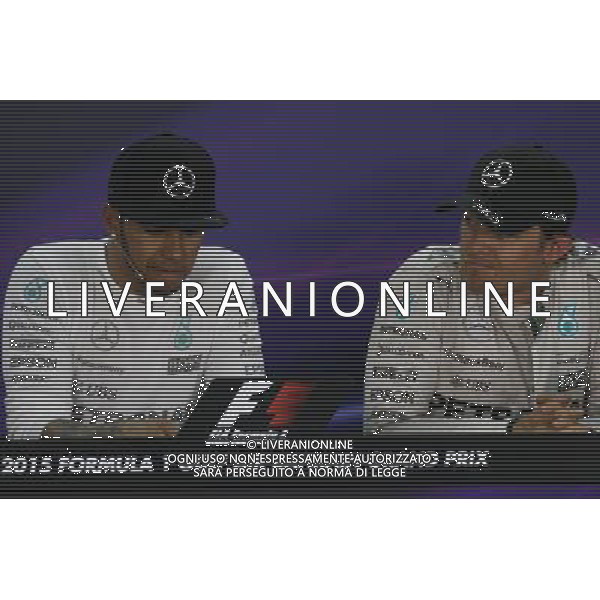 (L to R): Lewis Hamilton (GBR) Mercedes AMG F1 with team mate Nico Rosberg (GER) Mercedes AMG F1 in the FIA Press Conference. 19.04.2015. Formula 1 World Championship, Rd 4, Bahrain Grand Prix, Sakhir, Bahrain, Race Day. AG ALDO LIVERANI SAS ONLY ITALY