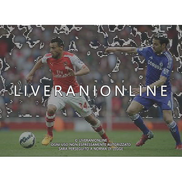 Arsenal\'s Francis Coquelin holds off the challenge from Chelsea\'s Cesc Fabregas Photographer Ashley Western/CameraSport Football - Barclays Premiership - Arsenal v Chelsea - Sunday 26th April 2015 - Emirates Stadium - London © CameraSport - 43 Linden Ave. Countesthorpe. Leicester. England. LE8 5PG - Tel: +44 (0) 116 277 4147 - admin@camerasport.com - www.camerasport.com /Agenzia Aldo Liverani Sas - ITALY ONLY - EDITORIAL USE ONLY