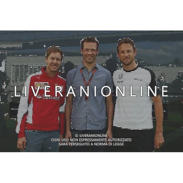 (L to R): Sebastian Vettel (GER) Ferrari with Alex Wurz (AUT) Williams Driver Mentor and Jenson Button (GBR) McLaren. 08.05.2015. Formula 1 World Championship, Rd 5, Spanish Grand Prix, Barcelona, Spain, Practice Day. AG ALDO LIVERANI SAS ONLY ITALY