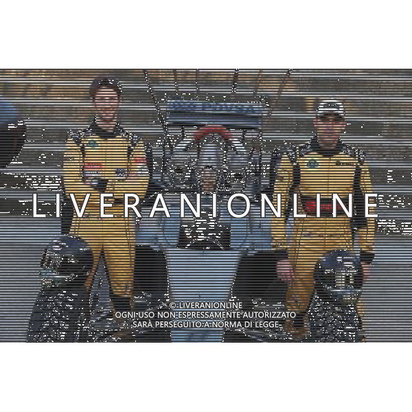 (L to R): Romain Grosjean (FRA) Lotus F1 Team and team mate Pastor Maldonado (VEN) Lotus F1 Team with special race overalls and car livery to promote the film Mad Max: Fury Road. 08.05.2015. Formula 1 World Championship, Rd 5, Spanish Grand Prix, Barcelona, Spain, Practice Day. AG ALDO LIVERANI SAS ONLY ITALY