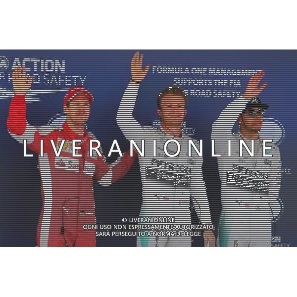 Qualifying top three in parc ferme (L to R): Sebastian Vettel (GER) Ferrari, third; Nico Rosberg (GER) Mercedes AMG F1, pole position; Lewis Hamilton (GBR) Mercedes AMG F1, second. 09.05.2015. Formula 1 World Championship, Rd 5, Spanish Grand Prix, Barcelona, Spain, Qualifying Day. AG ALDO LIVERANI SAS ONLY ITALY