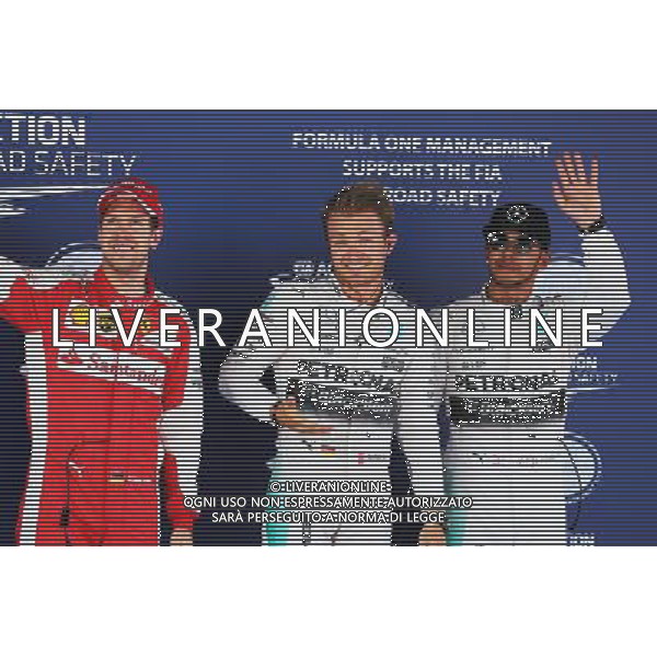 Qualifying top three in parc ferme (L to R): Sebastian Vettel (GER) Ferrari, third; Nico Rosberg (GER) Mercedes AMG F1, pole position; Lewis Hamilton (GBR) Mercedes AMG F1, second. 09.05.2015. Formula 1 World Championship, Rd 5, Spanish Grand Prix, Barcelona, Spain, Qualifying Day. AG ALDO LIVERANI SAS ONLY ITALY