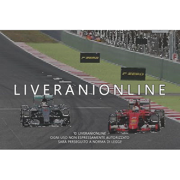 Sebastian Vettel (GER) Ferrari SF15-T and Lewis Hamilton (GBR) Mercedes AMG F1 W06 battle for position. 10.05.2015. Formula 1 World Championship, Rd 5, Spanish Grand Prix, Barcelona, Spain, Race Day. AG ALDO LIVERANI SAS ONLY ITALY