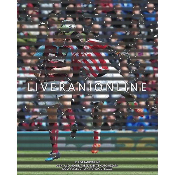 Burnley\'s Michael Duff vies for possession with Stoke City\'s Mame Biram Diouf Photographer Chris Vaughan/CameraSport Football - Barclays Premiership - Burnley v Stoke City - Saturday 16th May 2015 - Turf Moor - Burnley © CameraSport - 43 Linden Ave. Countesthorpe. Leicester. England. LE8 5PG - Tel: +44 (0) 116 277 4147 - admin@camerasport.com - www.camerasport.com AG ALDO LIVERANI SAS ONLY ITALY