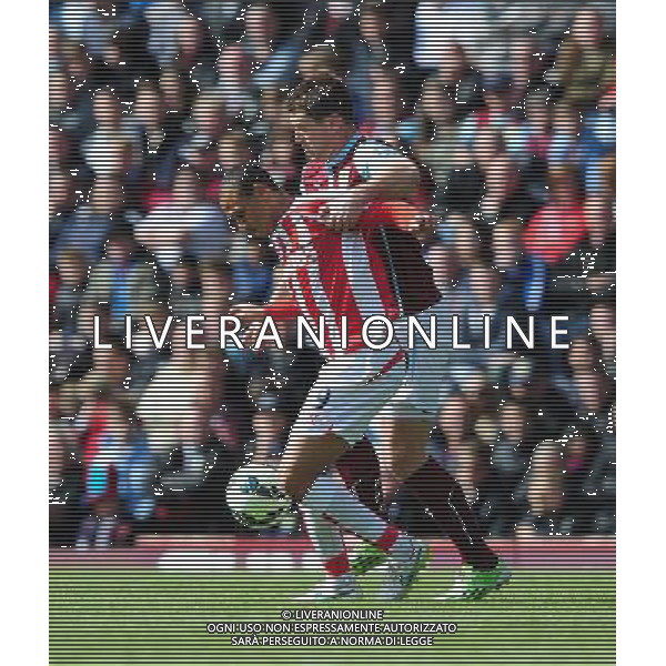 Burnley\'s Sam Vokes vies for possession with Stoke City\'s Peter Odemwingie Photographer Chris Vaughan/CameraSport Football - Barclays Premiership - Burnley v Stoke City - Saturday 16th May 2015 - Turf Moor - Burnley Â¬Â© CameraSport - 43 Linden Ave. Countesthorpe. Leicester. England. LE8 5PG - Tel: +44 (0) 116 277 4147 - admin@camerasport.com - www.camerasport.com AG ALDO LIVERANI SAS ONLY ITALY