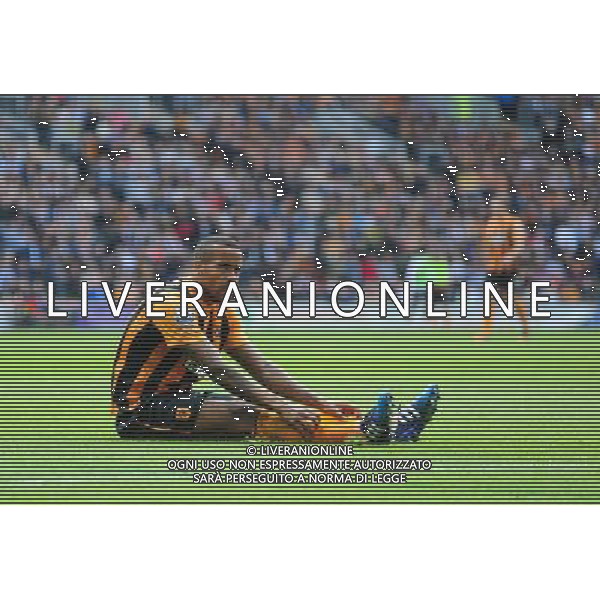 Hull City\'s Tom Huddlestone sits on the ground after he was fouled by Manchester United\'s Daley Blind Photographer Chris Vaughan/CameraSport Football - Barclays Premiership - Hull City v Manchester United - Sunday 24th May 2015 - Kingston Communications Stadium - Hull © CameraSport - 43 Linden Ave. Countesthorpe. Leicester. England. LE8 5PG - Tel: +44 (0) 116 277 4147 - admin@camerasport.com - www.camerasport.com AG ALDO LIVERANI SAS ONLY ITALY