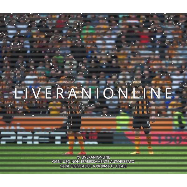 Hull City\'s Robbie Brady, left, and Hull City\'s Paul McShane at the end of the game as his sides relegation from the Barclays Premiership is confirmed Photographer Chris Vaughan/CameraSport Football - Barclays Premiership - Hull City v Manchester United - Sunday 24th May 2015 - Kingston Communications Stadium - Hull © CameraSport - 43 Linden Ave. Countesthorpe. Leicester. England. LE8 5PG - Tel: +44 (0) 116 277 4147 - admin@camerasport.com - www.camerasport.com AG ALDO LIVERANI SAS ONLY ITALY