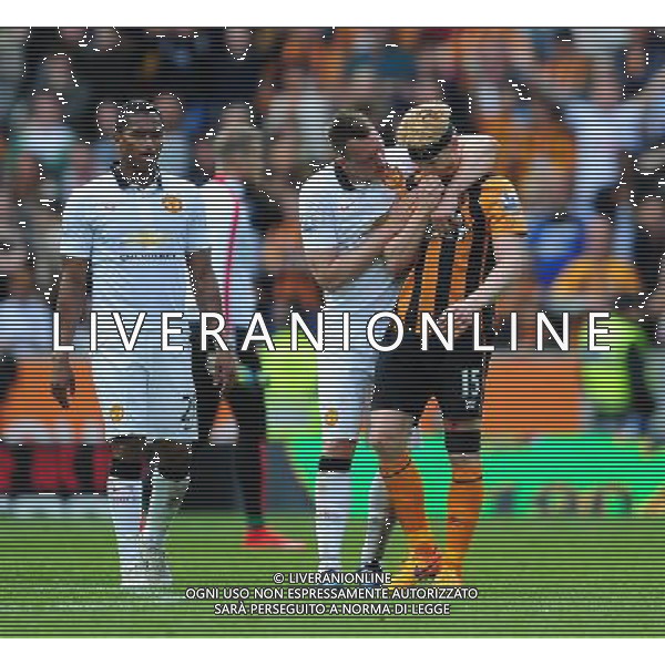 Manchester United\'s Phil Jones put his arm round Hull City\'s Paul McShane at the end of the game as his sides relegation from the Barclays Premiership is confirmed Photographer Chris Vaughan/CameraSport Football - Barclays Premiership - Hull City v Manchester United - Sunday 24th May 2015 - Kingston Communications Stadium - Hull © CameraSport - 43 Linden Ave. Countesthorpe. Leicester. England. LE8 5PG - Tel: +44 (0) 116 277 4147 - admin@camerasport.com - www.camerasport.com AG ALDO LIVERANI SAS ONLY ITALY