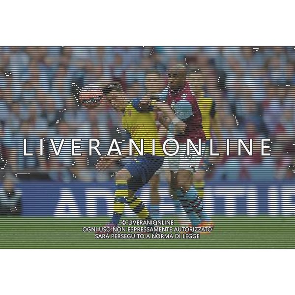 Arsenal\'s Mesut Ozil vies for possession with Aston Villa\'s Fabian Delph Photographer Ashley Crowden/CameraSport Football - The FA Cup Final - Aston Villa v Arsenal - Saturday 30th May 2015 - Wembley - London © CameraSport - 43 Linden Ave. Countesthorpe. Leicester. England. LE8 5PG - Tel: +44 (0) 116 277 4147 - admin@camerasport.com - www.camerasport.com AG ALDO LIVERANI SAS ONLY ITALY
