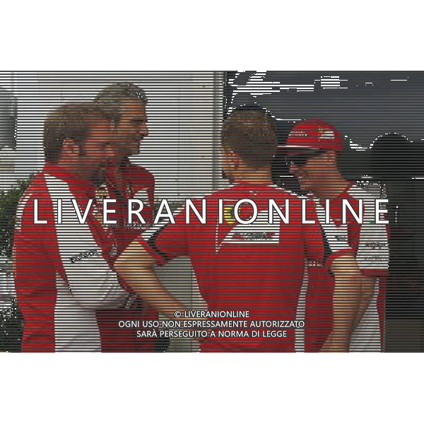 (L to R): Gino Rosato (CDN) Ferrari with Maurizio Arrivabene (ITA) Ferrari Team Principal; Sebastian Vettel (GER) Ferrari; and Kimi Raikkonen (FIN) Ferrari. 04.06.2015. Formula 1 World Championship, Rd 7, Canadian Grand Prix, Montreal, Canada, Preparation Day. /AGENZIA ALDO LIVERANI Sas - ITALY ONLY - EDITORIAL USE ONLY