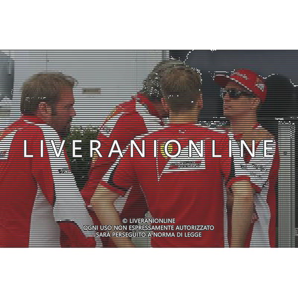 (L to R): Gino Rosato (CDN) Ferrari with Maurizio Arrivabene (ITA) Ferrari Team Principal; Sebastian Vettel (GER) Ferrari; and Kimi Raikkonen (FIN) Ferrari. 04.06.2015. Formula 1 World Championship, Rd 7, Canadian Grand Prix, Montreal, Canada, Preparation Day. /AGENZIA ALDO LIVERANI Sas - ITALY ONLY - EDITORIAL USE ONLY