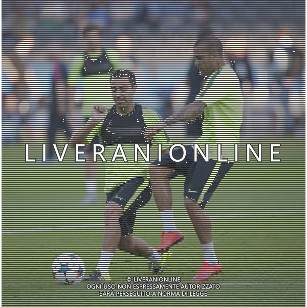 Barcelona\'s Xavi, left, and Barcelona\'s Daniel Alves during todays training session for tomorrows Final Photographer Chris Vaughan/CameraSport Football - Training Session - UEFA Champions League Final - Juventus v Barcelona - Friday 5th June 2015 - Olympiastadion - Berlin, Germany © CameraSport - 43 Linden Ave. Countesthorpe. Leicester. England. LE8 5PG - Tel: +44 (0) 116 277 4147 - admin@camerasport.com - www.camerasport.com /AGENZIA ALDO LIVERANI Sas - ITALY ONLY - EDITORIAL USE ONLY