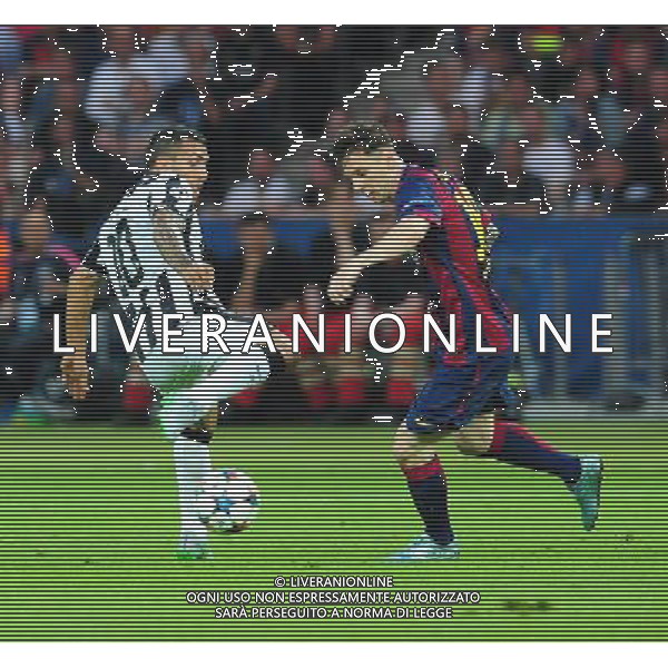 Barcelona\'s Lionel Messi is tackled by Juventus\' Carlos Tevez Photographer Chris Vaughan/CameraSport Football - UEFA Champions League Final - Juventus v Barcelona - Saturday 6th June 2015 - Olympiastadion - Berlin, Germany © CameraSport - 43 Linden Ave. Countesthorpe. Leicester. England. LE8 5PG - Tel: +44 (0) 116 277 4147 - admin@camerasport.com - www.camerasport.com /AGENZIA ALDO LIVERANI Sas - ITALY ONLY - EDITORIAL USE ONLY - Juventus - Barcellona UEFA Champions League 2014/2015 Finale Berlino - 06.06.2015