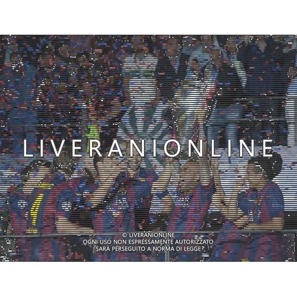 Barcelona\'s Daniel Alves lifts the Champions League Trophy Photographer Chris Vaughan/CameraSport Football - UEFA Champions League Final - Juventus v Barcelona - Saturday 6th June 2015 - Olympiastadion - Berlin, Germany Â© CameraSport - 43 Linden Ave. Countesthorpe. Leicester. England. LE8 5PG - Tel: +44 (0) 116 277 4147 - admin@camerasport.com - www.camerasport.com AG ALDO LIVERANI SAS ONLY ITALY