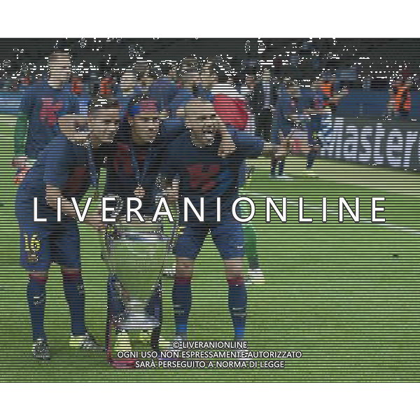 Barcelona players, from left, Douglas, Rafinha and Daniel Alves pose for photographs with the Champions League Trophy Photographer Chris Vaughan/CameraSport Football - UEFA Champions League Final - Juventus v Barcelona - Saturday 6th June 2015 - Olympiastadion - Berlin, Germany Â© CameraSport - 43 Linden Ave. Countesthorpe. Leicester. England. LE8 5PG - Tel: +44 (0) 116 277 4147 - admin@camerasport.com - www.camerasport.com AG ALDO LIVERANI SAS ONLY ITALY