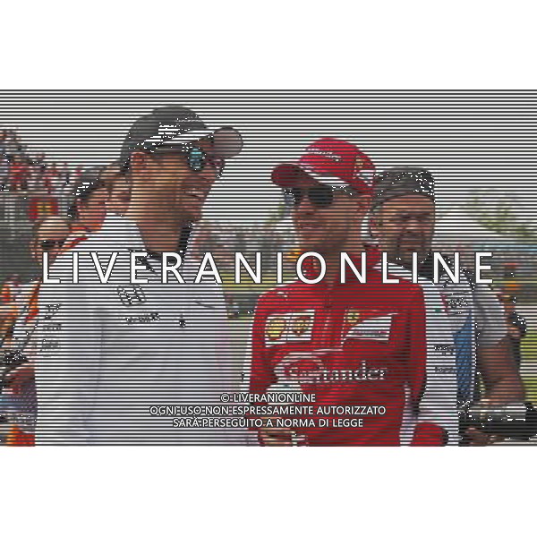 (L to R): Jenson Button (GBR) McLaren with Sebastian Vettel (GER) Ferrari on the drivers parade. 07.06.2015. Formula 1 World Championship, Rd 7, Canadian Grand Prix, Montreal, Canada, Race Day. /AGENZIA ALDO LIVERANI Sas - ITALY ONLY - EDITORIAL USE ONLY