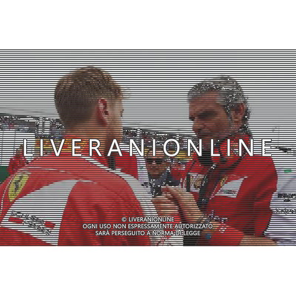 Sebastian Vettel (GER) Ferrari with Maurizio Arrivabene (ITA) Ferrari Team Principal on the grid. 07.06.2015. Formula 1 World Championship, Rd 7, Canadian Grand Prix, Montreal, Canada, Race Day. AG ALDO LIVERANI SAS ONLY ITALY