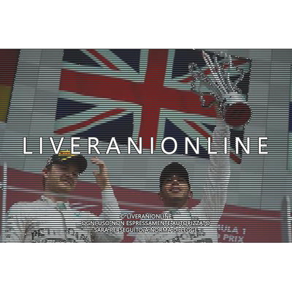 Race winner Lewis Hamilton (GBR) Mercedes AMG F1 (Right) celebrates on the podium with second placed team mate Nico Rosberg (GER) Mercedes AMG F1. 07.06.2015. Formula 1 World Championship, Rd 7, Canadian Grand Prix, Montreal, Canada, Race Day. AG ALDO LIVERANI SAS ONLY ITALY