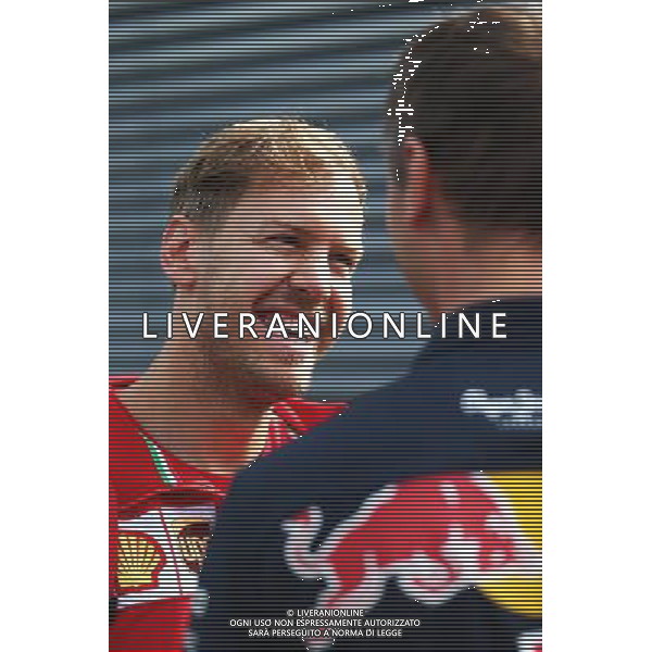 (L to R): Sebastian Vettel (GER) Ferrari with Ole Schack (DEN) Red Bull Racing Mechanic. 19.06.2015. Formula 1 World Championship, Rd 8, Austrian Grand Prix, Spielberg, Austria, Practice Day. /AGENZIA ALDO LIVERANI Sas - ITALY ONLY - EDITORIAL USE ONLY - Prove Libere