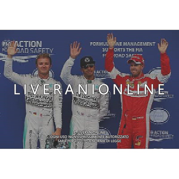 Qualifying top three in parc ferme (L to R): Nico Rosberg (GER) Mercedes AMG F1, second; Lewis Hamilton (GBR) Mercedes AMG F1, pole position; Sebastian Vettel (GER) Ferrari, third. 20.06.2015. Formula 1 World Championship, Rd 8, Austrian Grand Prix, Spielberg, Austria, Qualifying Day. /AGENZIA ALDO LIVERANI Sas - ITALY ONLY - EDITORIAL USE ONLY - Prove Ufficiali