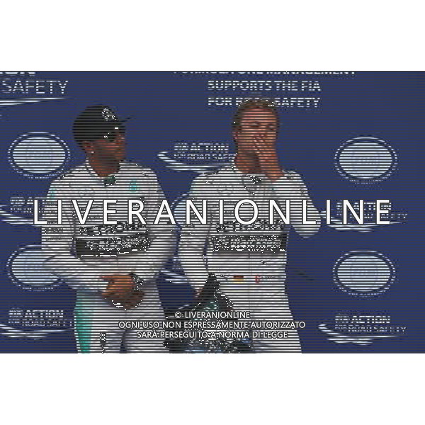 (L to R): pole sitter Lewis Hamilton (GBR) Mercedes AMG F1 with second placed team mate Nico Rosberg (GER) Mercedes AMG F1 in parc ferme. 20.06.2015. Formula 1 World Championship, Rd 8, Austrian Grand Prix, Spielberg, Austria, Qualifying Day. - www.xpbimages.com, EMail: requests@xpbimages.com - copy of publication required for printed pictures. Every used picture is fee-liable. © Copyright: Batchelor / XPB Images /AGENZIA ALDO LIVERANI Sas - ITALY ONLY - EDITORIAL USE ONLY - prove ufficiali
