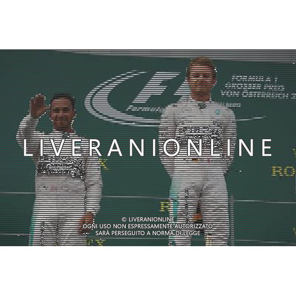 The podium (L to R): second placed Lewis Hamilton (GBR) Mercedes AMG F1 celebrates with race winner Nico Rosberg (GER) Mercedes AMG F1. 21.06.2015. Formula 1 World Championship, Rd 8, Austrian Grand Prix, Spielberg, Austria, Race Day. /AGENZIA ALDO LIVERANI Sas - ITALY ONLY - EDITORIAL USE ONLY - GARA
