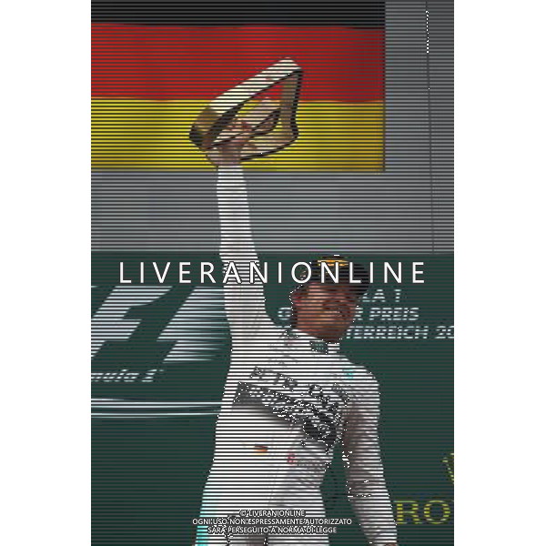 Race winner Nico Rosberg (GER) Mercedes AMG F1 celebrates on the podium. 21.06.2015. Formula 1 World Championship, Rd 8, Austrian Grand Prix, Spielberg, Austria, Race Day. /AGENZIA ALDO LIVERANI Sas - ITALY ONLY - EDITORIAL USE ONLY - GARA