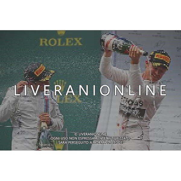 Race winner Nico Rosberg (GER) Mercedes AMG F1 celebrates with the champagne with Felipe Massa (BRA) Williams (Left) on the podium. 21.06.2015. Formula 1 World Championship, Rd 8, Austrian Grand Prix, Spielberg, Austria, Race Day. /AGENZIA ALDO LIVERANI Sas - ITALY ONLY - EDITORIAL USE ONLY - GARA