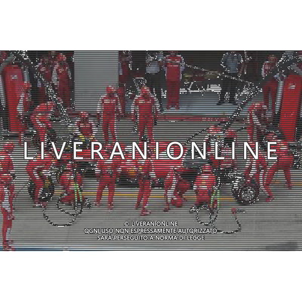 Sebastian Vettel (GER) Ferrari SF15-T has a long pit stop with a stuck rear right wheel. 21.06.2015. Formula 1 World Championship, Rd 8, Austrian Grand Prix, Spielberg, Austria, Race Day. AG ALDO LIVERANI SAS ONLY ITALY