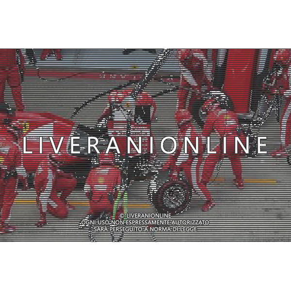Sebastian Vettel (GER) Ferrari SF15-T has a long pit stop with a stuck rear right wheel. 21.06.2015. Formula 1 World Championship, Rd 8, Austrian Grand Prix, Spielberg, Austria, Race Day. AG ALDO LIVERANI SAS ONLY ITALY