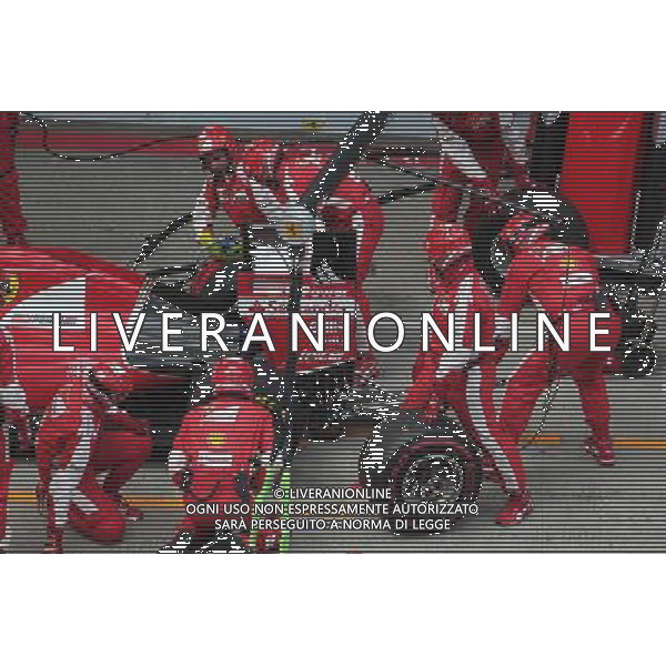 Sebastian Vettel (GER) Ferrari SF15-T has a long pit stop with a stuck rear right wheel. 21.06.2015. Formula 1 World Championship, Rd 8, Austrian Grand Prix, Spielberg, Austria, Race Day. AG ALDO LIVERANI SAS ONLY ITALY