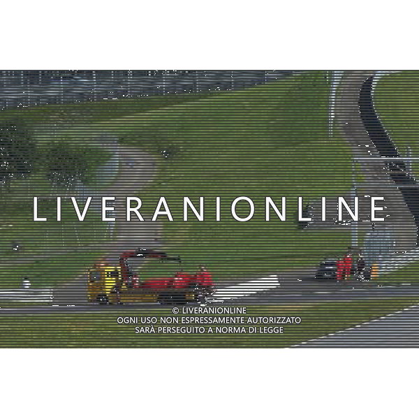 The Ferrari SF15-T oaf Antonio Fuoco (ITA) Ferrari Test Driver is recovered back to the pits on the back of a truck. 23.06.2015. Formula 1 Testing, Day One, Spielberg, Austria, Tuesday. 