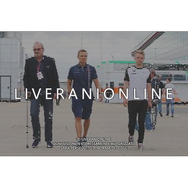 (L to R): Didier Coton (BEL) Driver Manager with Antti Vierula (FIN) Personal Trainer and Kevin Magnussen (DEN) McLaren Test and Reserve Driver. 02.07.2015. Formula 1 World Championship, Rd 9, British Grand Prix, Silverstone, England, Preparation Day. /AGENZIA ALDO LIVERANI Sas - ITALY ONLY - EDITORIAL USE ONLY - Gp F1 inghilterra