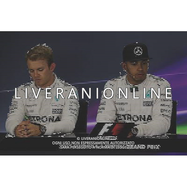 (L to R): Nico Rosberg (GER) Mercedes AMG F1 with team mate Lewis Hamilton (GBR) Mercedes AMG F1 in the FIA Press Conference. 04.07.2015. Formula 1 World Championship, Rd 9, British Grand Prix, Silverstone, England, Qualifying Day. AG ALDO LIVERANI SAS ONLY ITALY