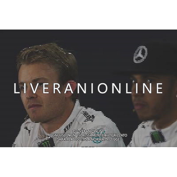 (L to R): Nico Rosberg (GER) Mercedes AMG F1 with team mate Lewis Hamilton (GBR) Mercedes AMG F1 in the FIA Press Conference. 04.07.2015. Formula 1 World Championship, Rd 9, British Grand Prix, Silverstone, England, Qualifying Day. AG ALDO LIVERANI SAS ONLY ITALY