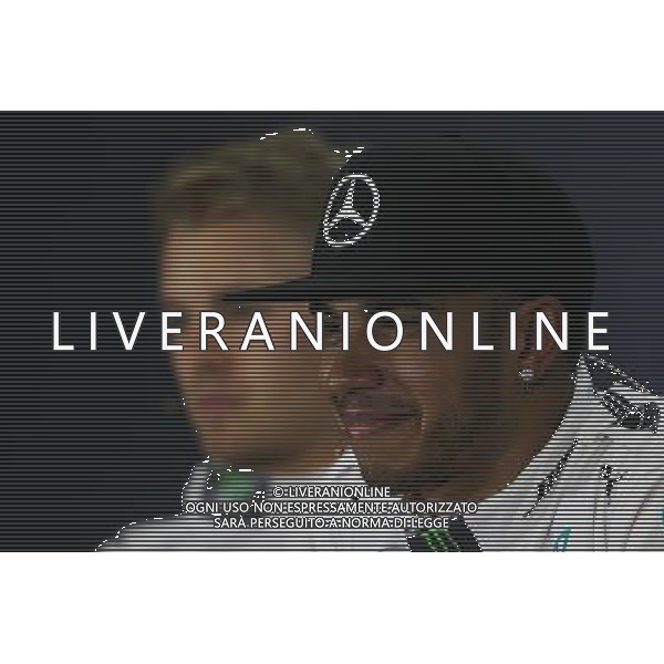 (L to R): Nico Rosberg (GER) Mercedes AMG F1 with team mate Lewis Hamilton (GBR) Mercedes AMG F1 in the FIA Press Conference. 04.07.2015. Formula 1 World Championship, Rd 9, British Grand Prix, Silverstone, England, Qualifying Day. AG ALDO LIVERANI SAS ONLY ITALY