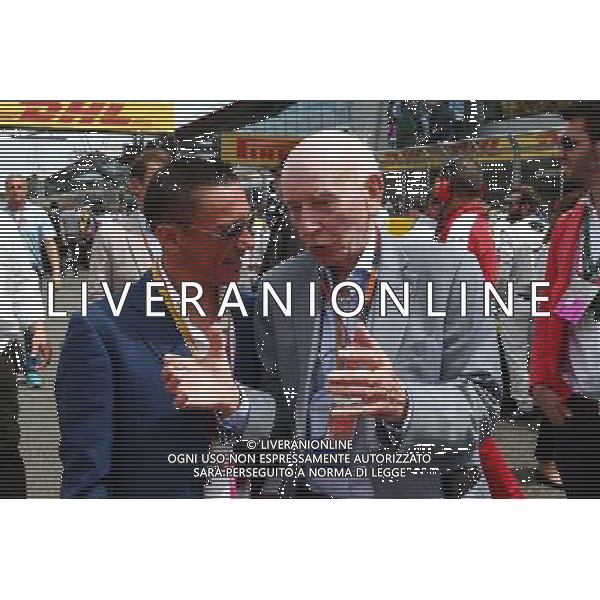 (L to R): Frankie Dettori (ITA) Jockey with John Surtees (GBR) on the grid. 05.07.2015. Formula 1 World Championship, Rd 9, British Grand Prix, Silverstone, England, Race Day. AG ALDO LIVERANI SAS ONLY ITALY