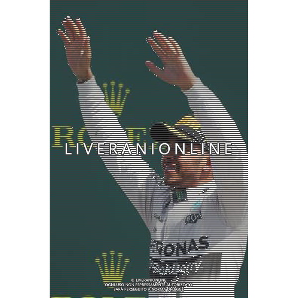 Race winner Lewis Hamilton (GBR) Mercedes AMG F1 celebrates on the podium. 05.07.2015. Formula 1 World Championship, Rd 9, British Grand Prix, Silverstone, England, Race Day. AG ALDO LIVERANI SAS ONLY ITALY