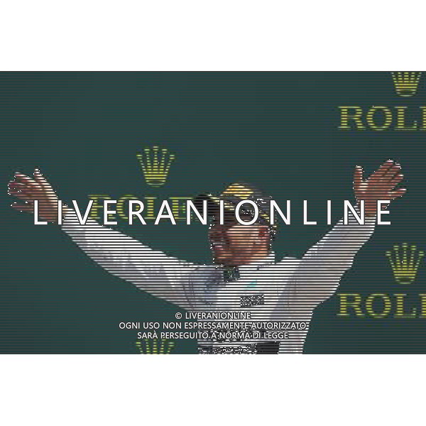 Race winner Lewis Hamilton (GBR) Mercedes AMG F1 celebrates on the podium. 05.07.2015. Formula 1 World Championship, Rd 9, British Grand Prix, Silverstone, England, Race Day. AG ALDO LIVERANI SAS ONLY ITALY