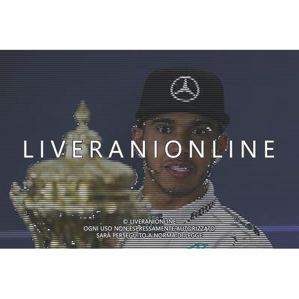 Race winner Lewis Hamilton (GBR) Mercedes AMG F1 in the FIA Press Conference with his race trophy. 05.07.2015. Formula 1 World Championship, Rd 9, British Grand Prix, Silverstone, England, Race Day. AG ALDO LIVERANI SAS ONLY ITALY